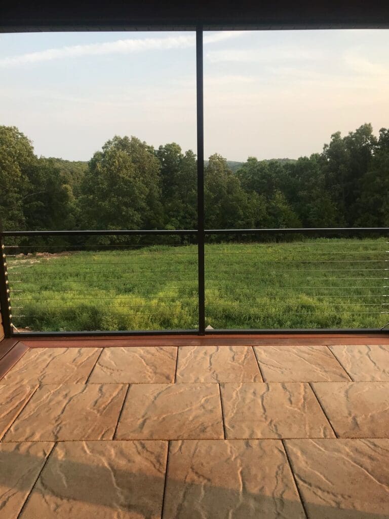 The patio's center is made from tile and while wood outlines perimeter of the patio